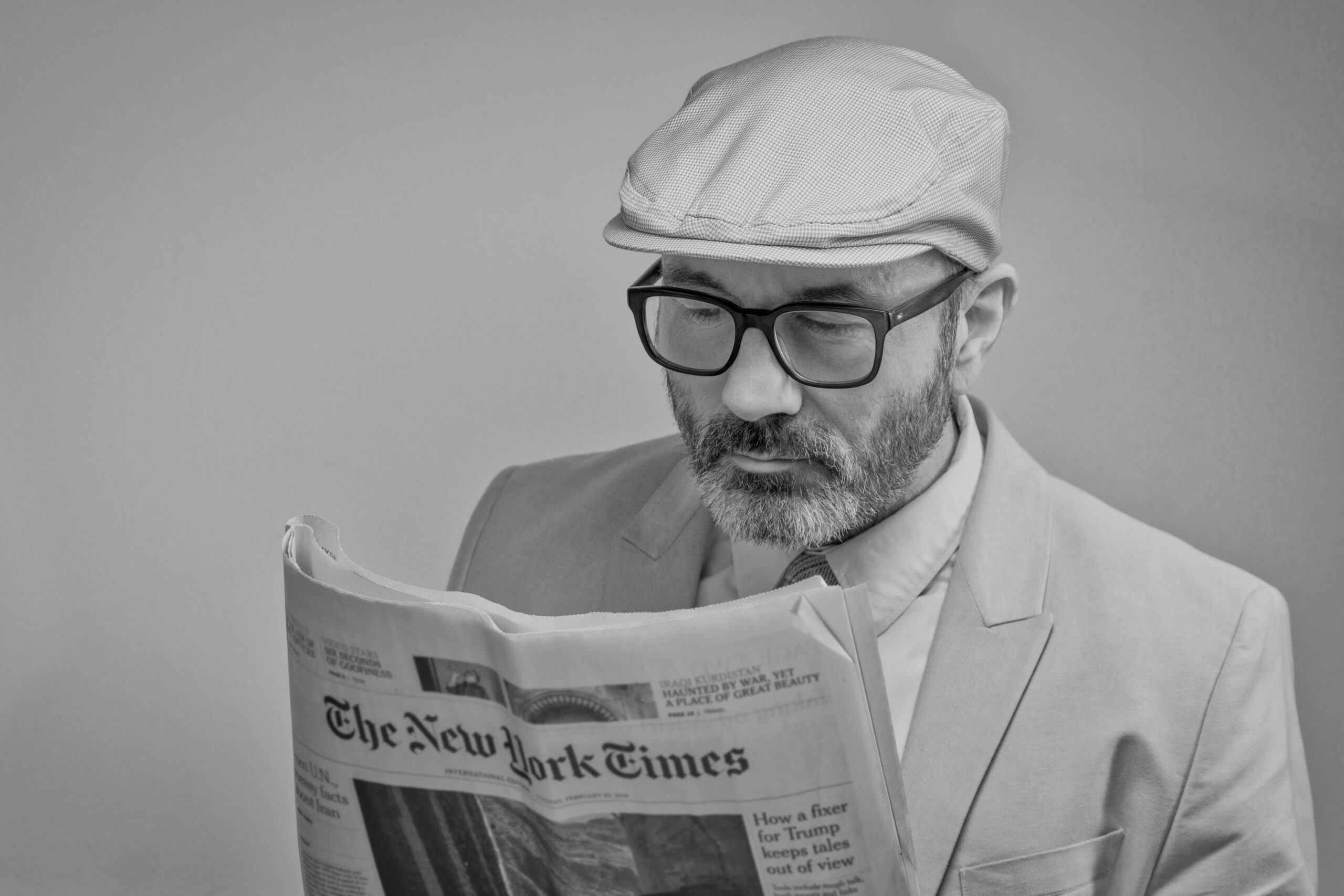 man reading newspaper reading glasses